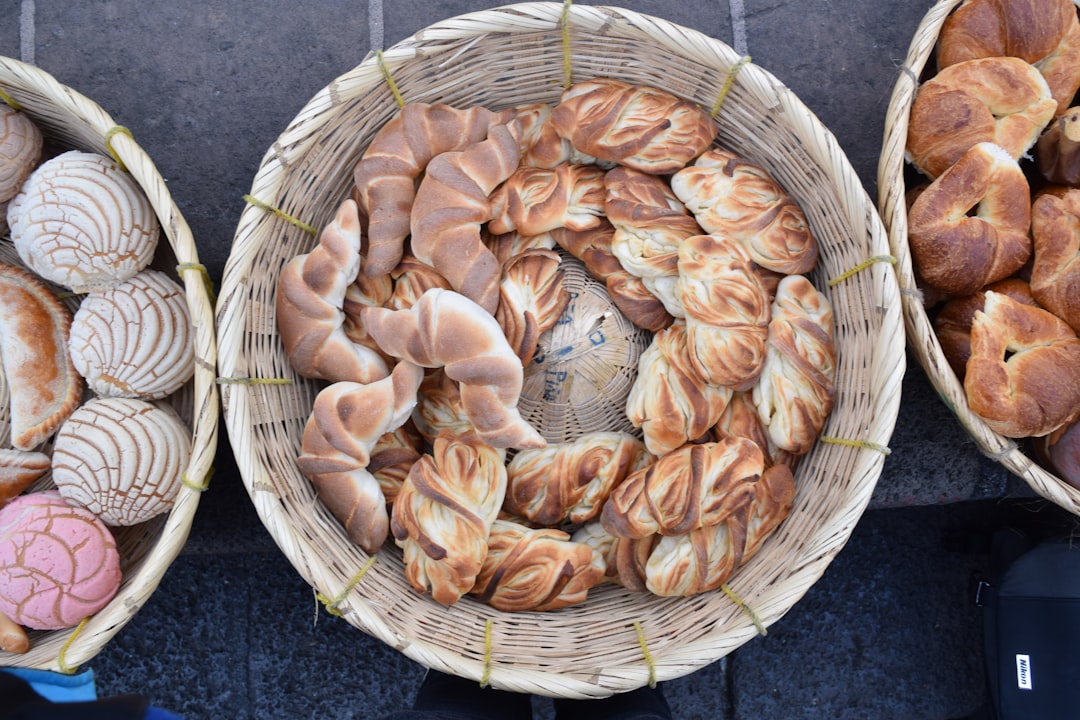 a couple of baskets filled with different types of bread