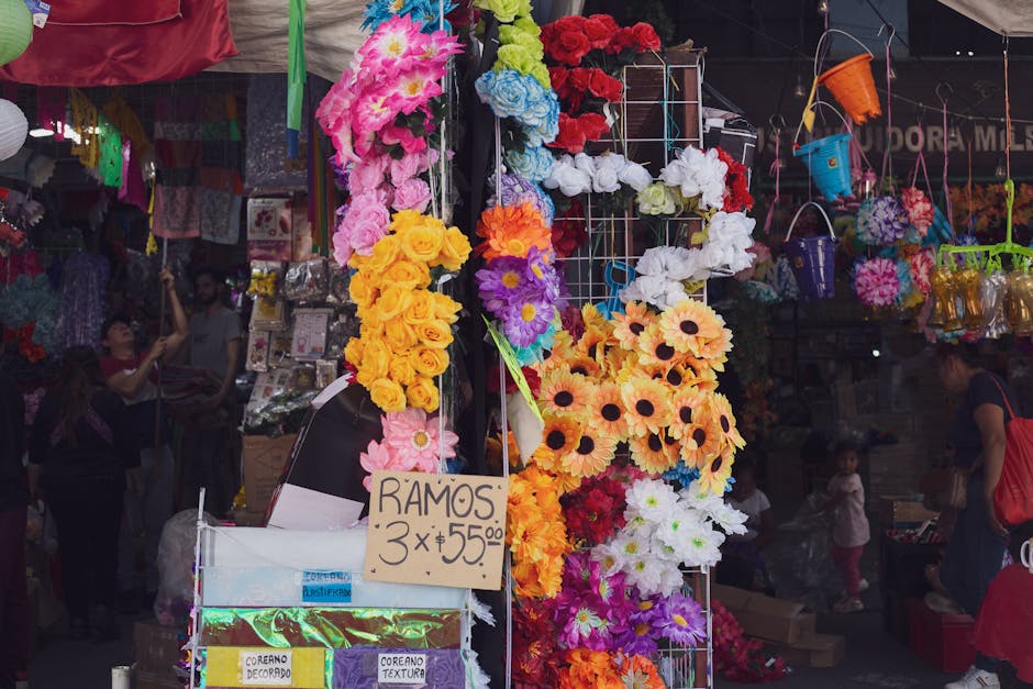 Colorful flower arrangements at a bustling Mexico City market showcasing vibrant hues and lively street scenes.