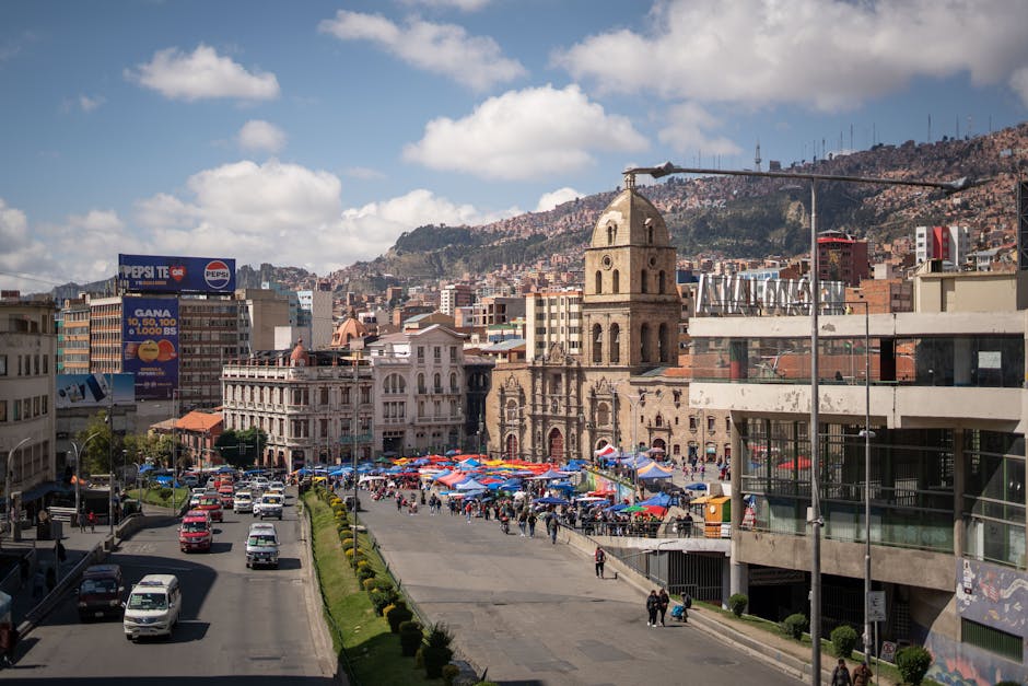 Explore the bustling market in La Paz, Bolivia, with its historic architecture and lively atmosphere.