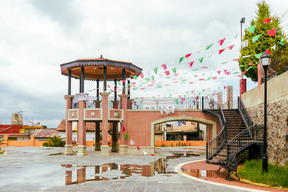 Vibrant terrace with festive banners in San Mateo Atarasquillo, Mexico, showcasing cultural architecture.