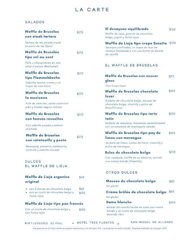 Interior acogedor con los dueños atendiendo a los clientes en Wafflessence de Paul — ambiente y personal