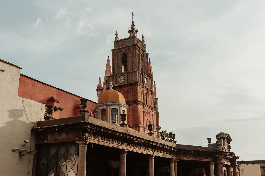 an old building with a clock tower in the background