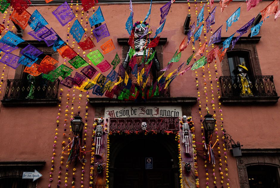 Colorful Day of the Dead decorations adorn a building in San Miguel de Allende, Mexico.