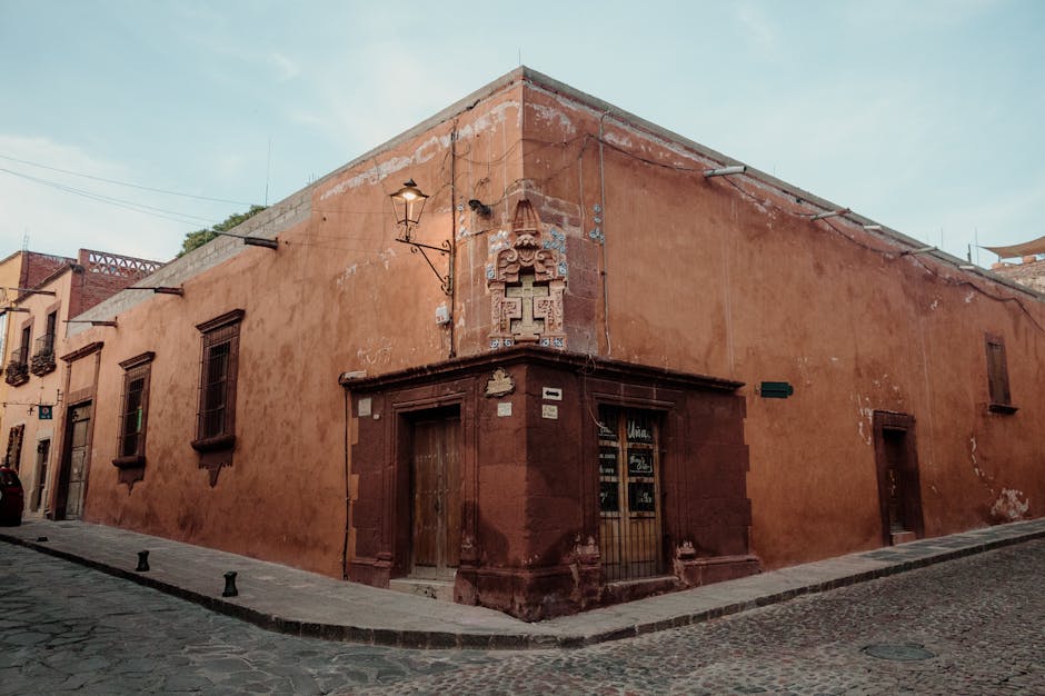 Charming rustic street corner with historic architecture in San Miguel de Allende, Mexico.