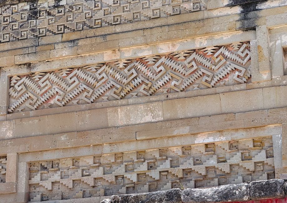 Close-up of detailed stone carvings at Mitla, showcasing ancient Zapotec architecture.