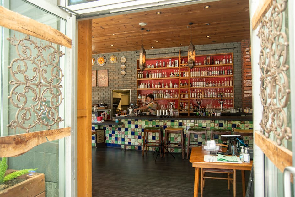 Charming Mexican-themed bar in San Francisco with vibrant tiles and bottles.