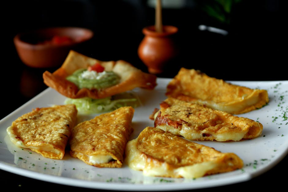 Tasty Mexican quesadillas served with a side of guacamole, making a perfect appetizer or snack.