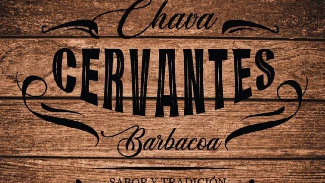 Barbacoa CHAVA preparando carne a la parrilla en su fogón abierto — primer plano del asador y el chef volteando la carne.