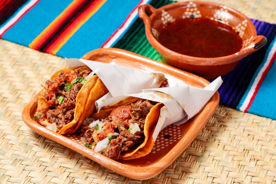 Delicious Mexican tacos filled with savory meat, served with salsa in Tuxtla Gutiérrez, Mexico.