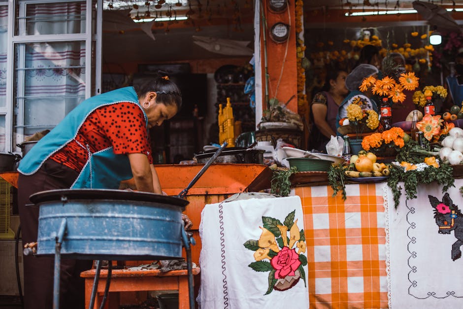 A woman works at a vibrant market stall in Janitzio, Michoacán, Mexico, showcasing local culture.