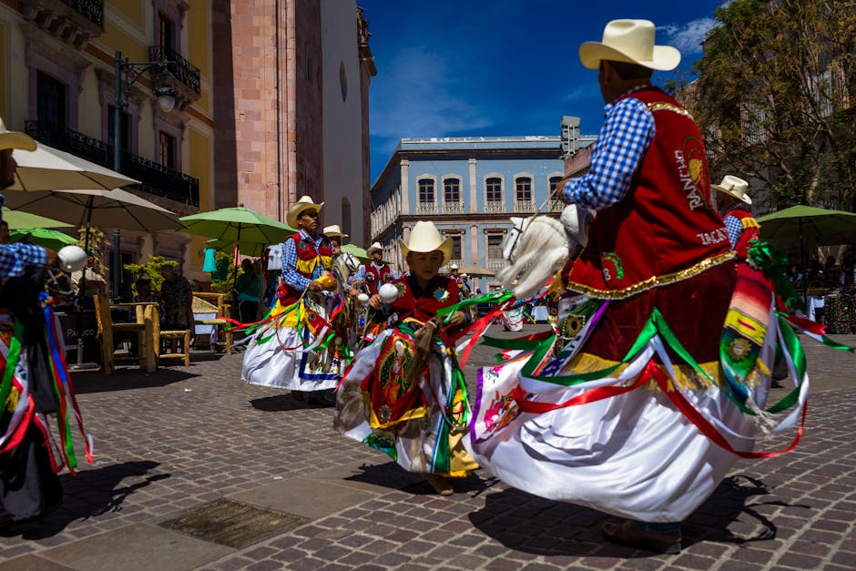 Colorful traditional dance performance in Mexican city streets, celebrating cultural heritage.